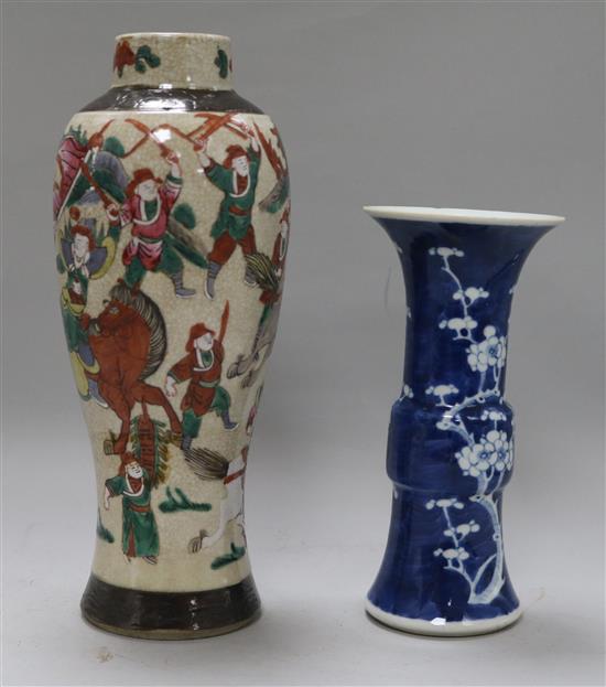 A Chinese blue and white Gu vase, decorated with prunus blossom and a crackleware vase, H 20cm & 29cm